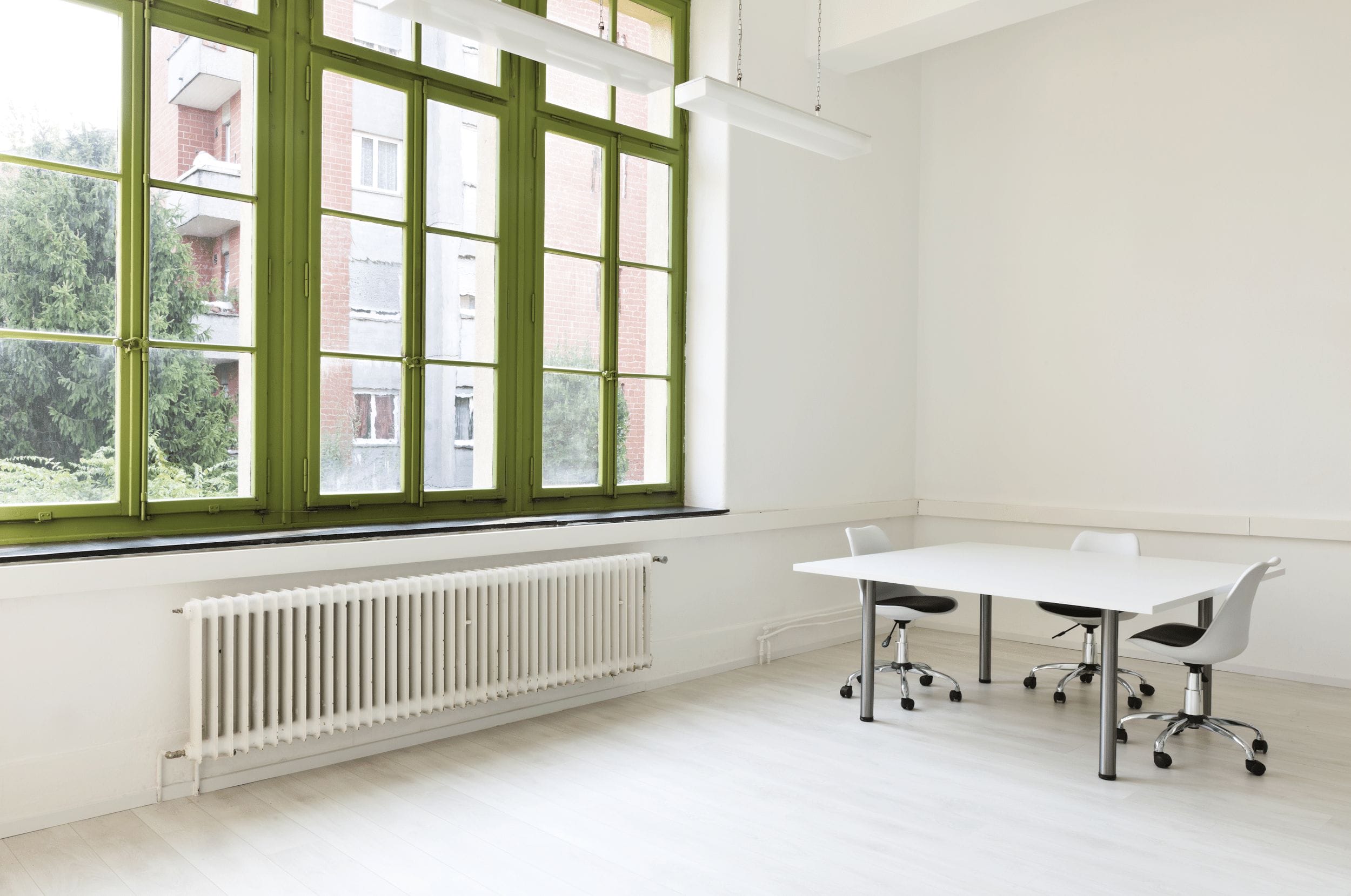 large office radiator supplied with hot water by a commercial boiler