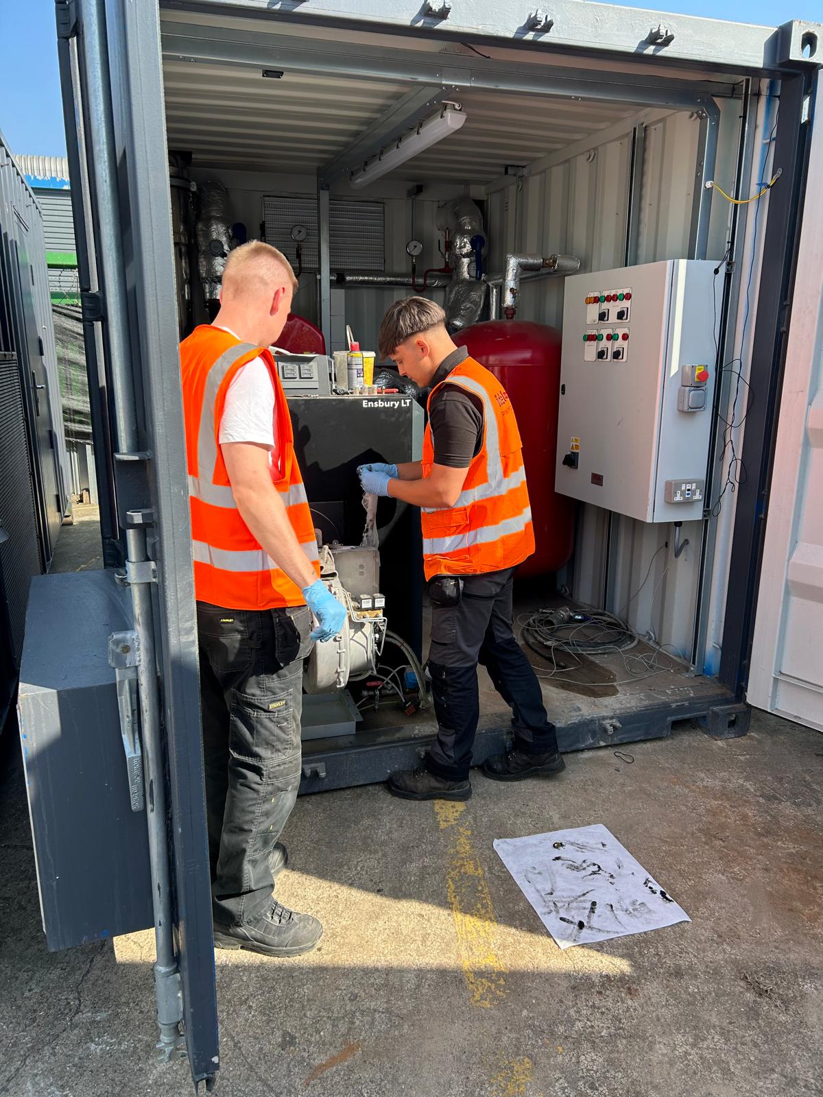 engineers working on a temporary boiler
